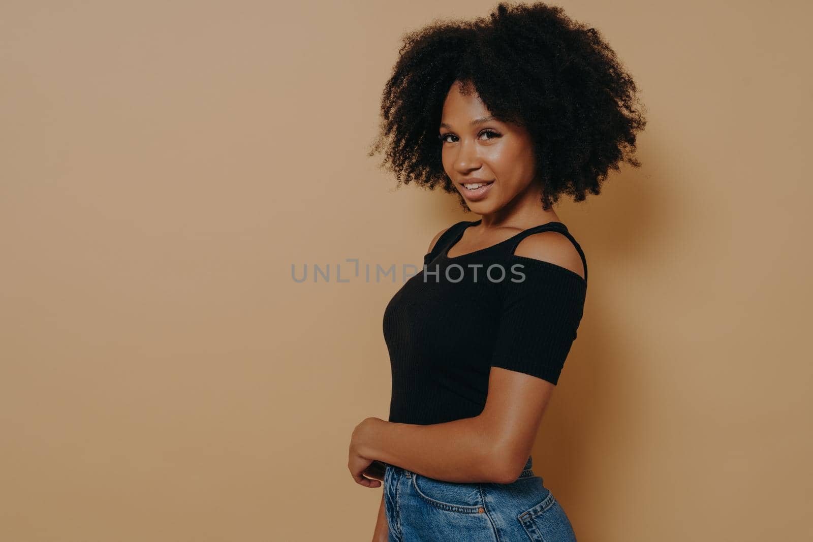 Profile portrait of cute gorgeous african american girl with beaming smile in casual outfit by vkstock