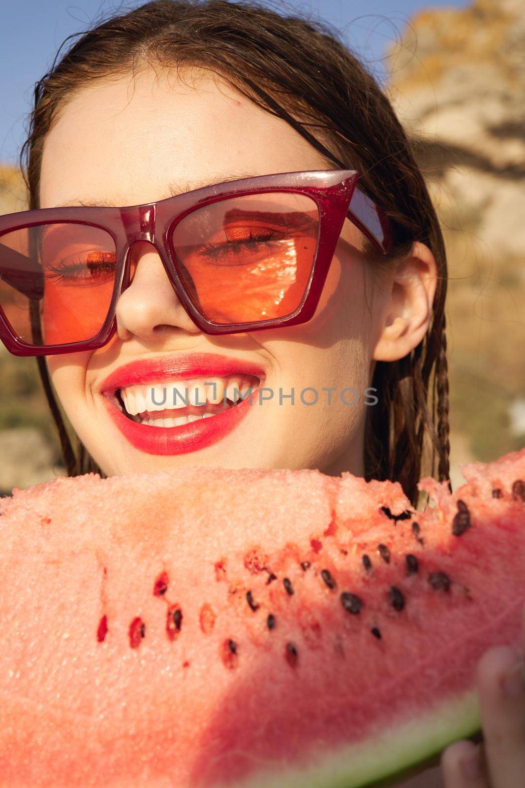 woman eating watermelon outdoors Sun summer close-up. High quality photo