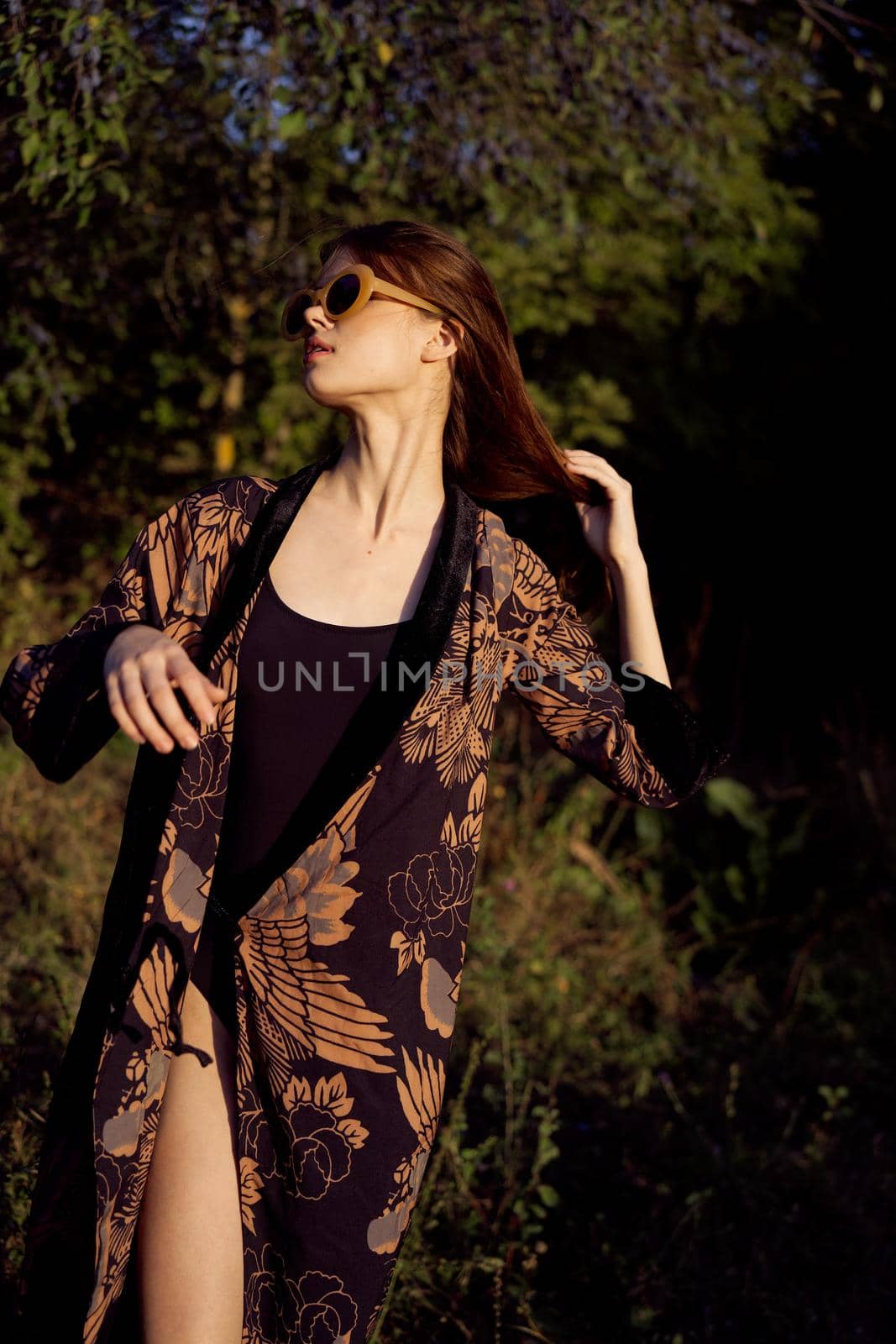 pretty woman in fashionable clothes sunglasses nature posing. High quality photo