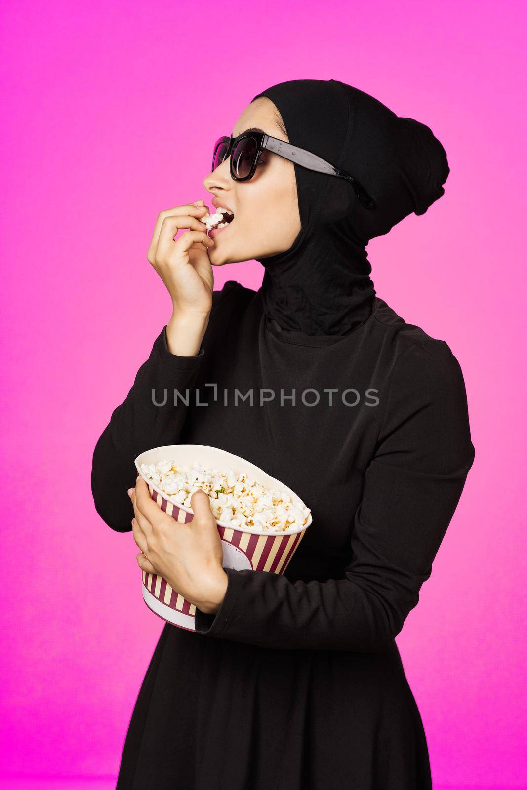arab woman fun popcorn entertainment fashion isolated background by Vichizh