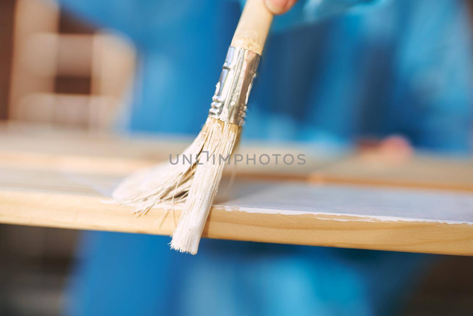 woman paints wooden objects painter decoration home renovation. High quality photo