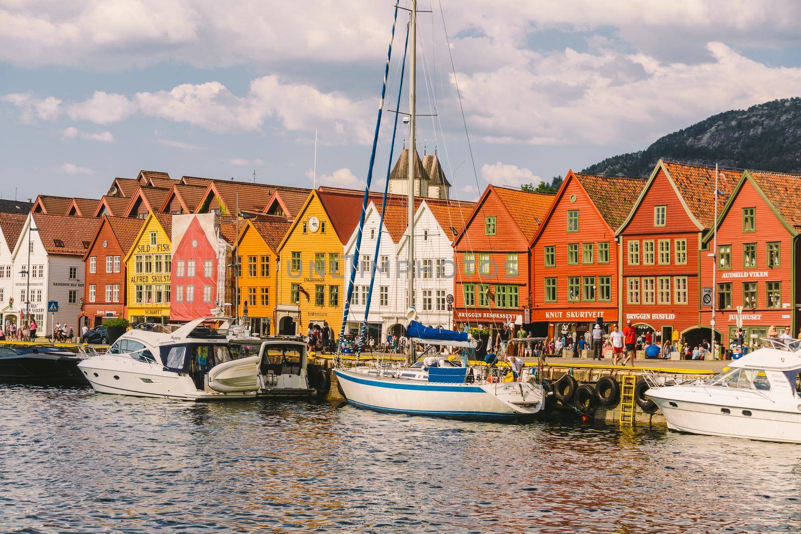 Bergen, Norway. View of historical buildings in Bryggen. Hanseatic wharf in Bergen, Norway July 28, 2019. UNESCO. Famous Bryggen street with wooden colored houses in Bergen Akerbrygge distric by Tomashevska