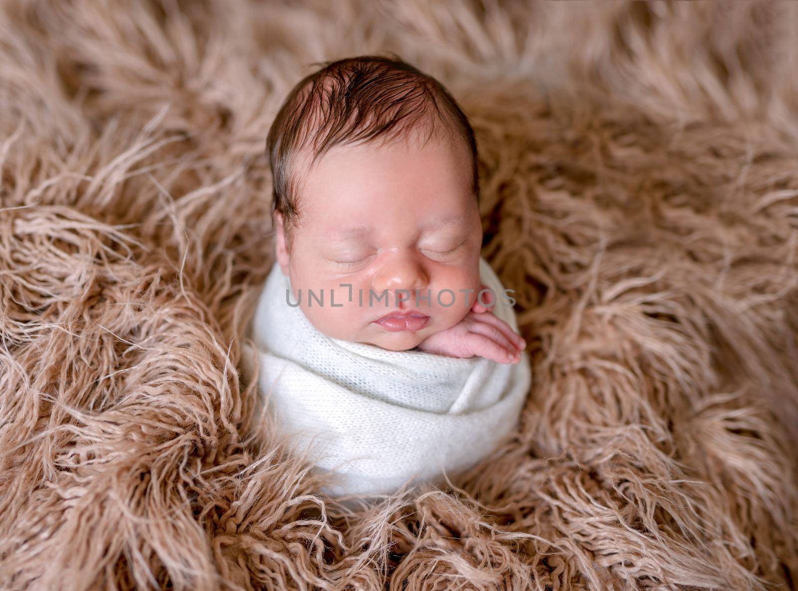 Cute sleeping newborn baby boy