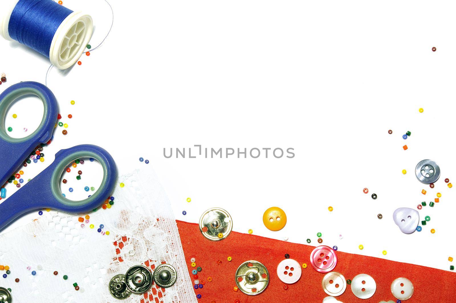 Red fabric, buttons and colorful beads as background