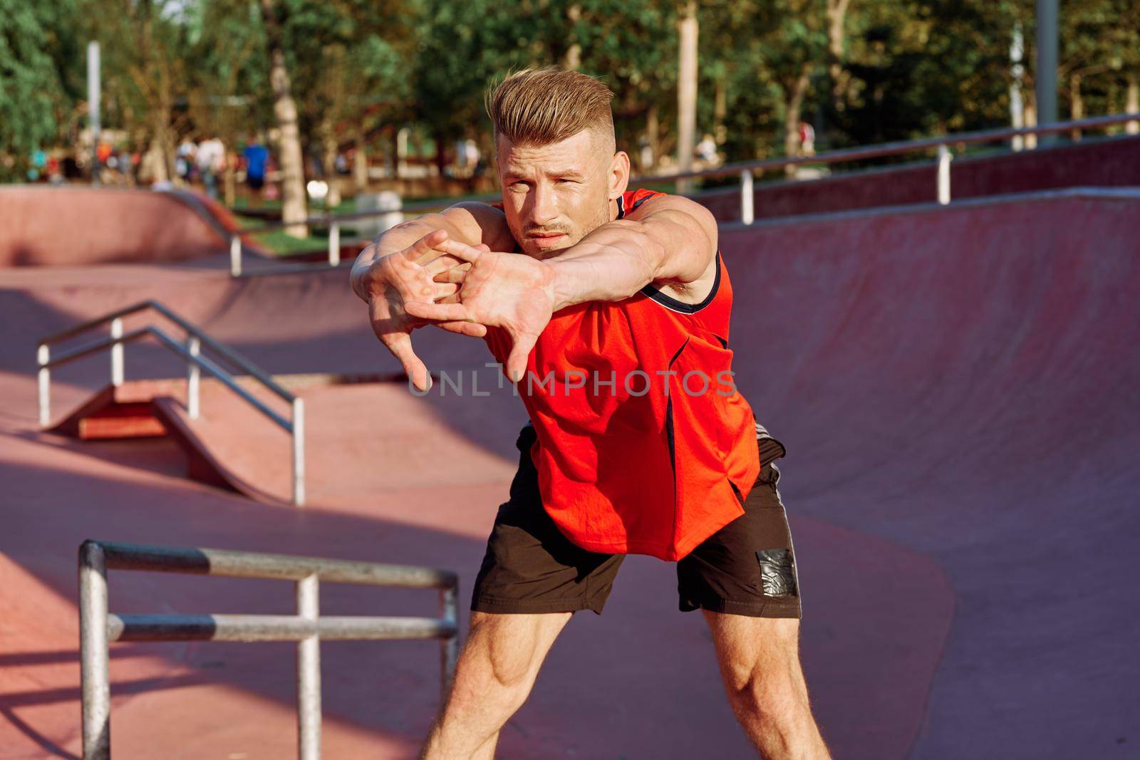 sports man on the playground in the park workout by Vichizh