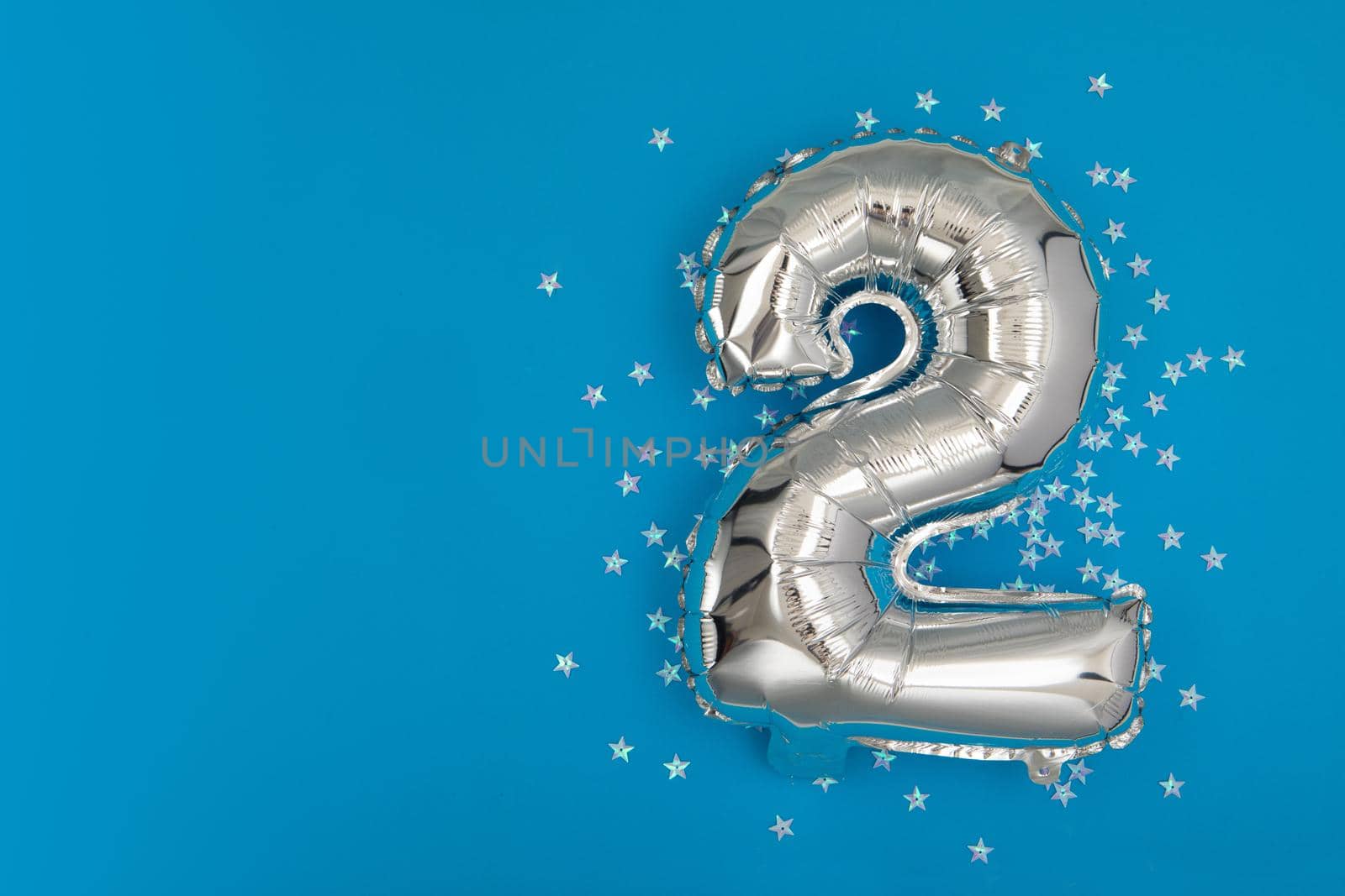 Silver balloon 2 on a blue background with confetti stars by Demkat