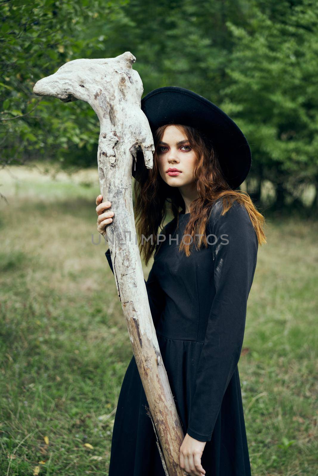 woman in witch costume fantasy magic forest posing by Vichizh