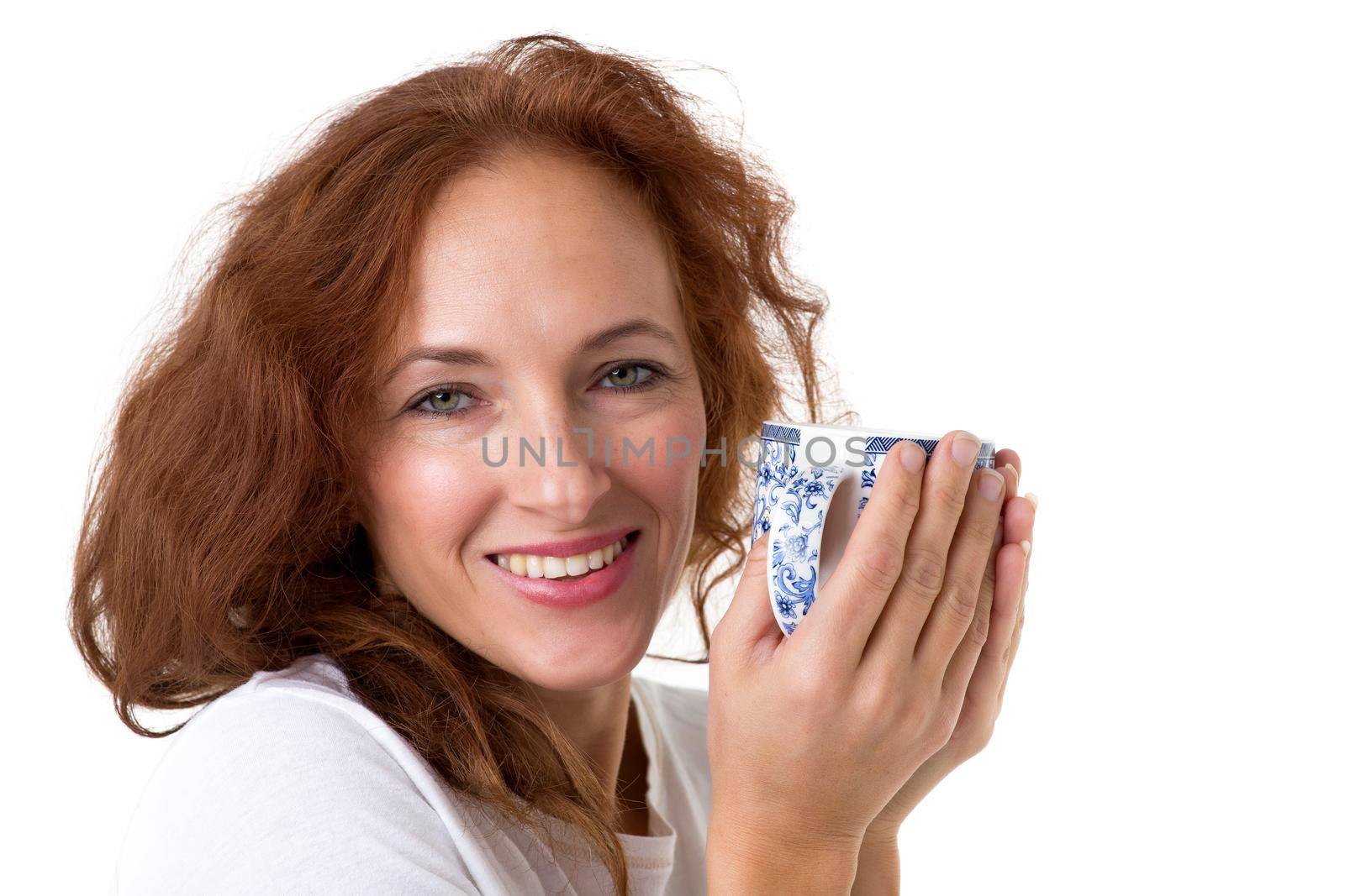 Smiling woman holding porcelain mug by kolesnikov_studio