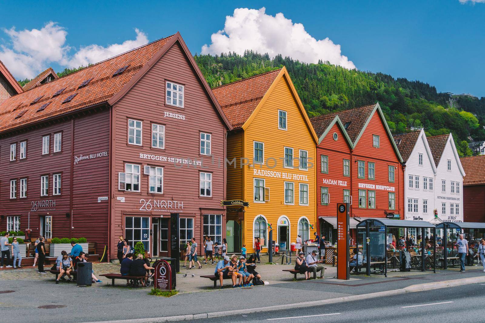 Bergen, Norway. View of historical buildings in Bryggen. Hanseatic wharf in Bergen, Norway July 28, 2019. UNESCO. Famous Bryggen street with wooden colored houses in Bergen Akerbrygge distric.