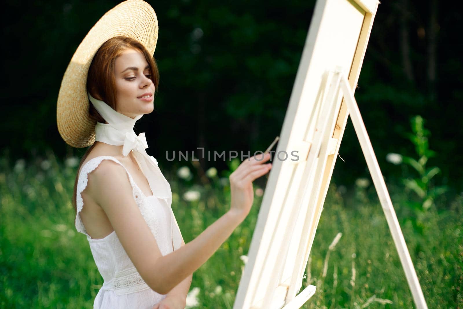 Woman in white dress artist hobby nature landscape. High quality photo