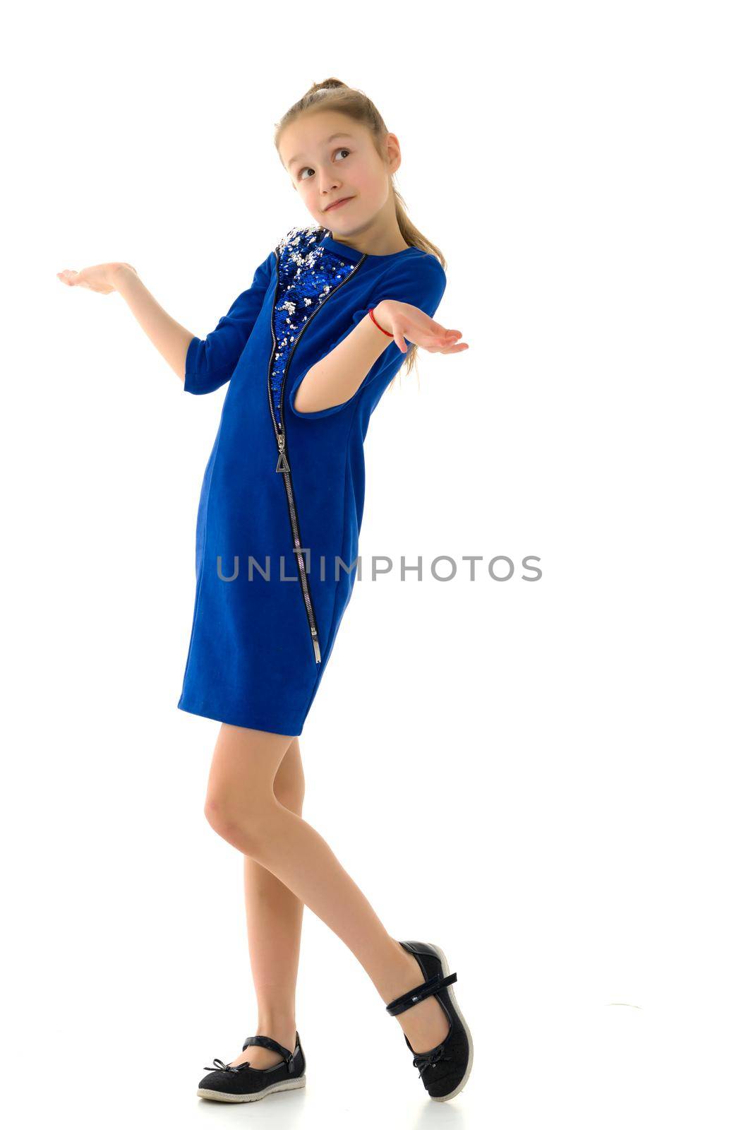 Beautiful Girl Spread her Hands and Shrugging Shoulders, I Do Not Know, Oops, Sorry, Cute Emotional Teenage Girl Wearing Dress and Black Shoes Showing Helpless Gesture, Isolated on White Background.
