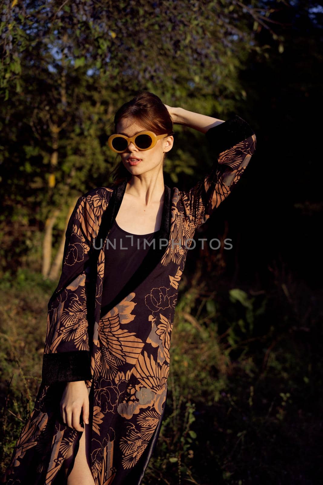 pretty woman in fashionable clothes sunglasses nature posing. High quality photo