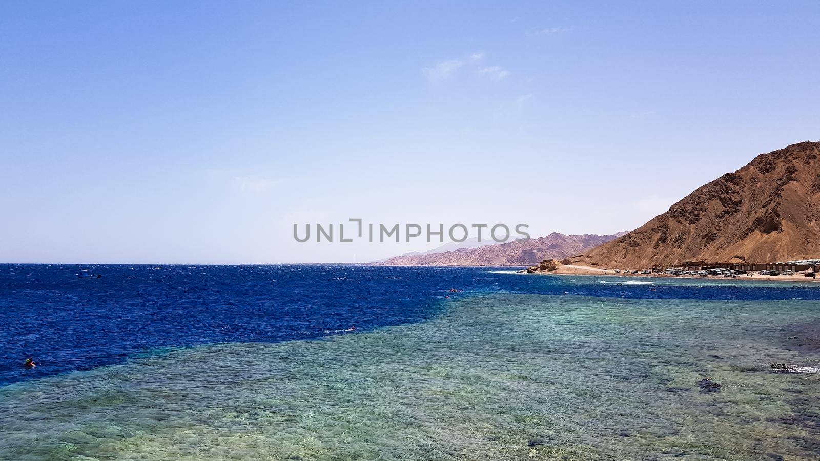 The Blue Hole is a popular diving spot in East Sinai. Sunny beach resort on the Red Sea in Dahab. A famous tourist destination near Sharm el Sheikh. Bright sunshine.