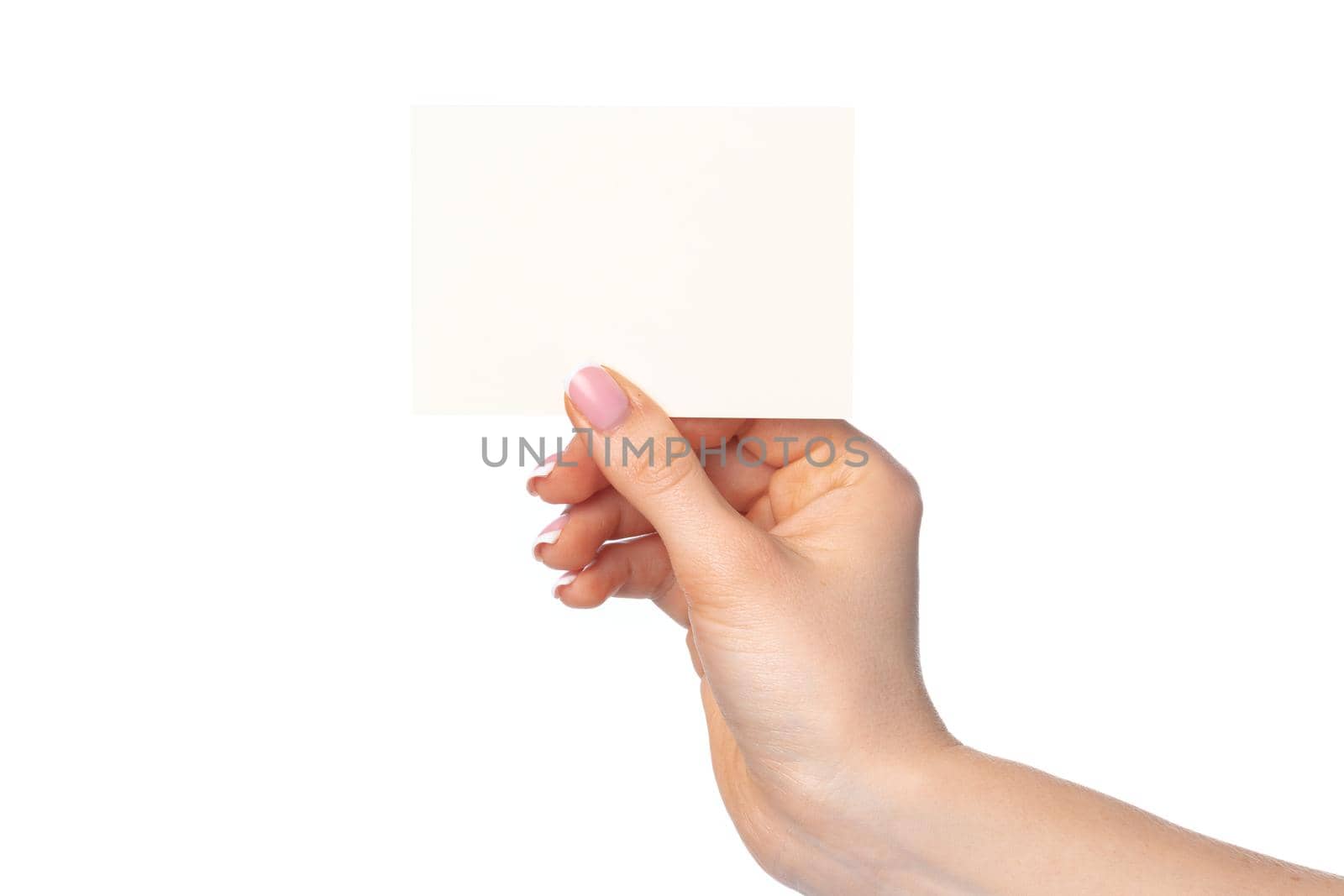 Woman's hand with blank white business card isolated on white background