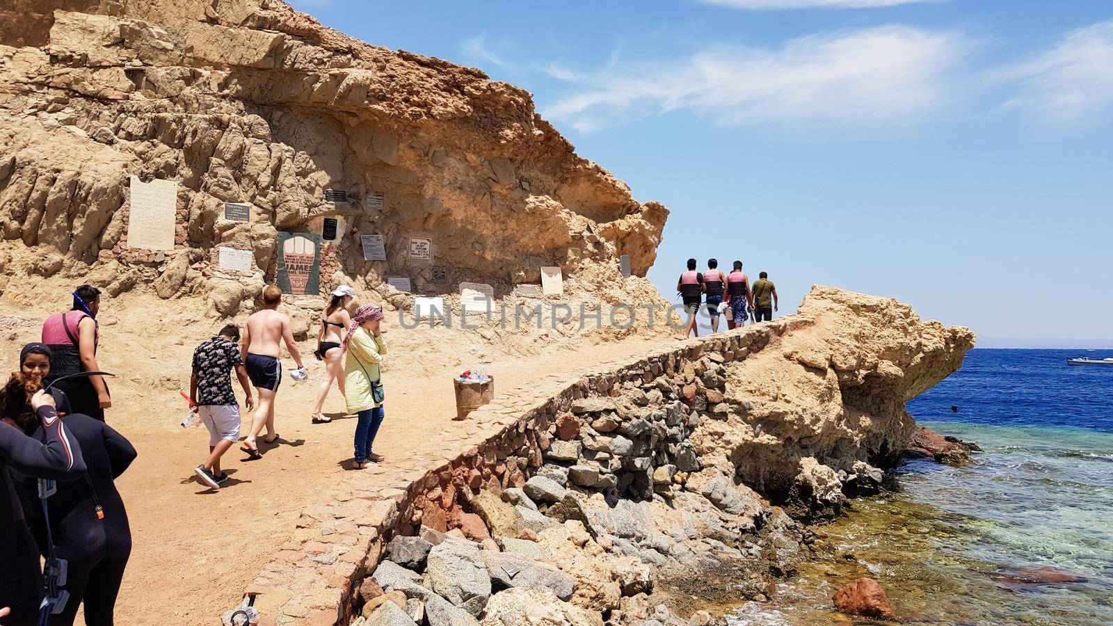 Egypt, Dahab - October 17, 2019: The Blue Hole is a popular diving spot in East Sinai. Sunny beach resort on the Red Sea in Dahab. A famous tourist destination near Sharm el Sheikh. Bright sunshine.