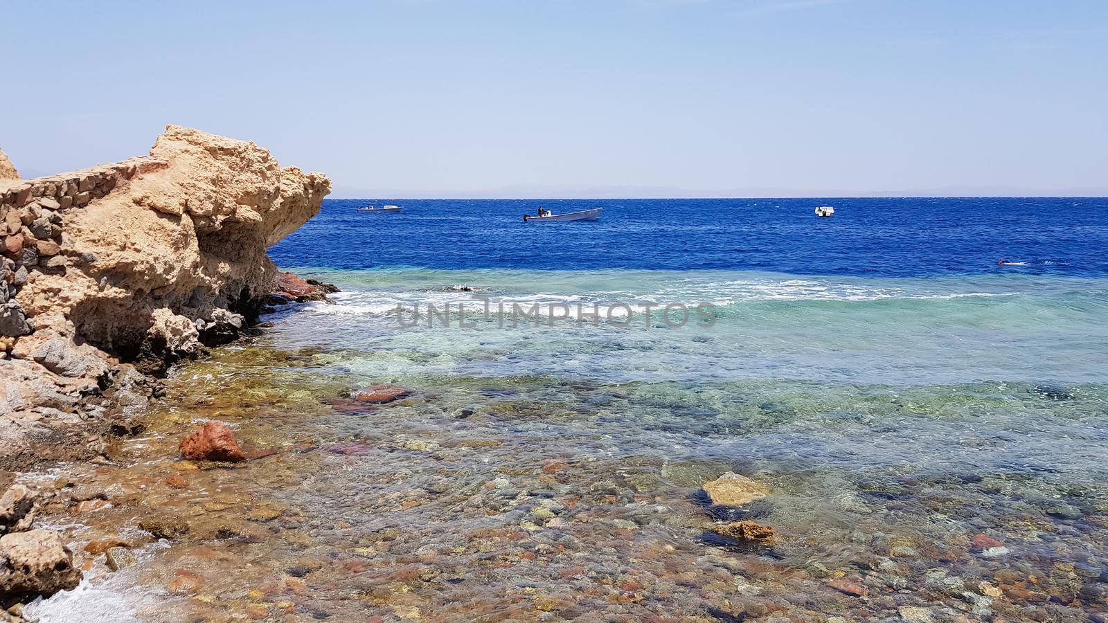 The Blue Hole is a popular diving spot in East Sinai. Sunny beach resort on the Red Sea in Dahab. A famous tourist destination near Sharm el Sheikh. Bright sunshine.