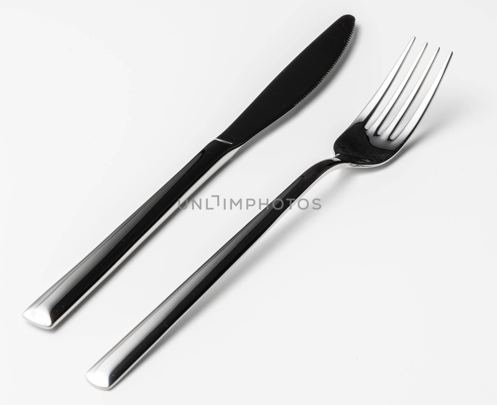 Fork and knife isolated on white background. Close up.