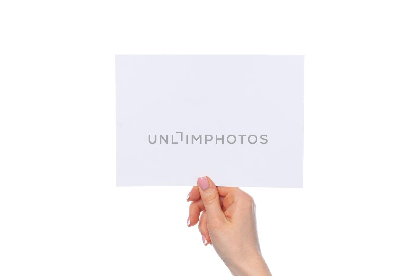 Female hand holding blank white sheet of paper isolated on white background