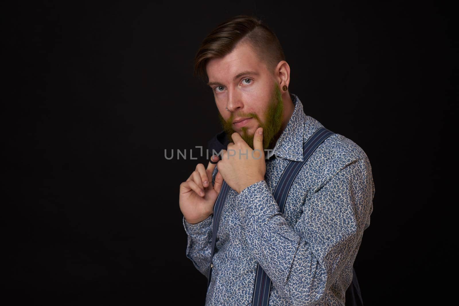 business man in shirt with jacket over his shoulders posing self confidence. High quality photo