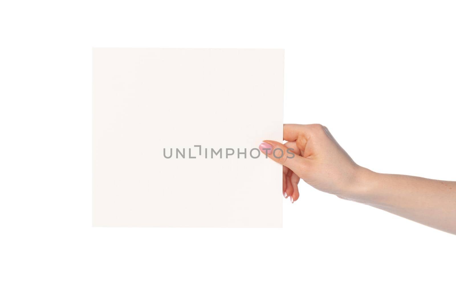 Woman's hand showing white paper banner isolated on white background