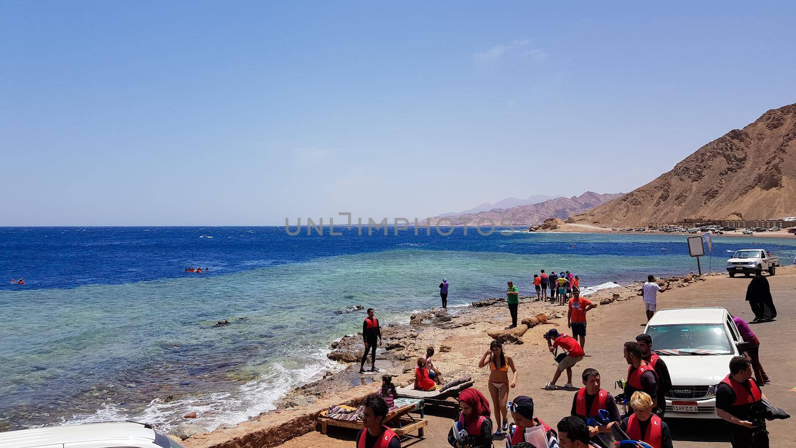 Egypt, Dahab - October 17, 2019: The Blue Hole is a popular diving spot in East Sinai. Sunny beach resort on the Red Sea in Dahab. A famous tourist destination near Sharm el Sheikh. Bright sunshine.