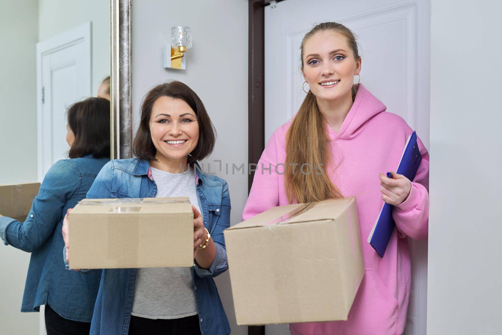 Delivery of goods, two women with cardboard boxes near front door of house by VH-studio