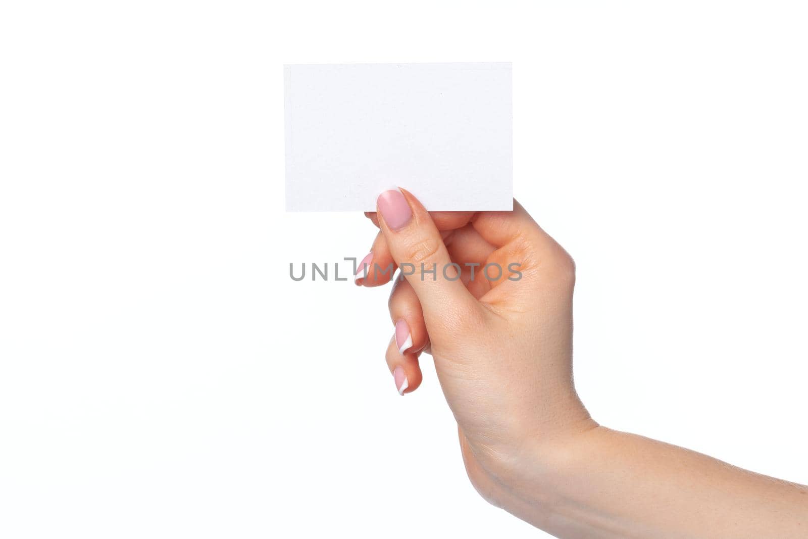 Female hand with blank white business card isolated on white background