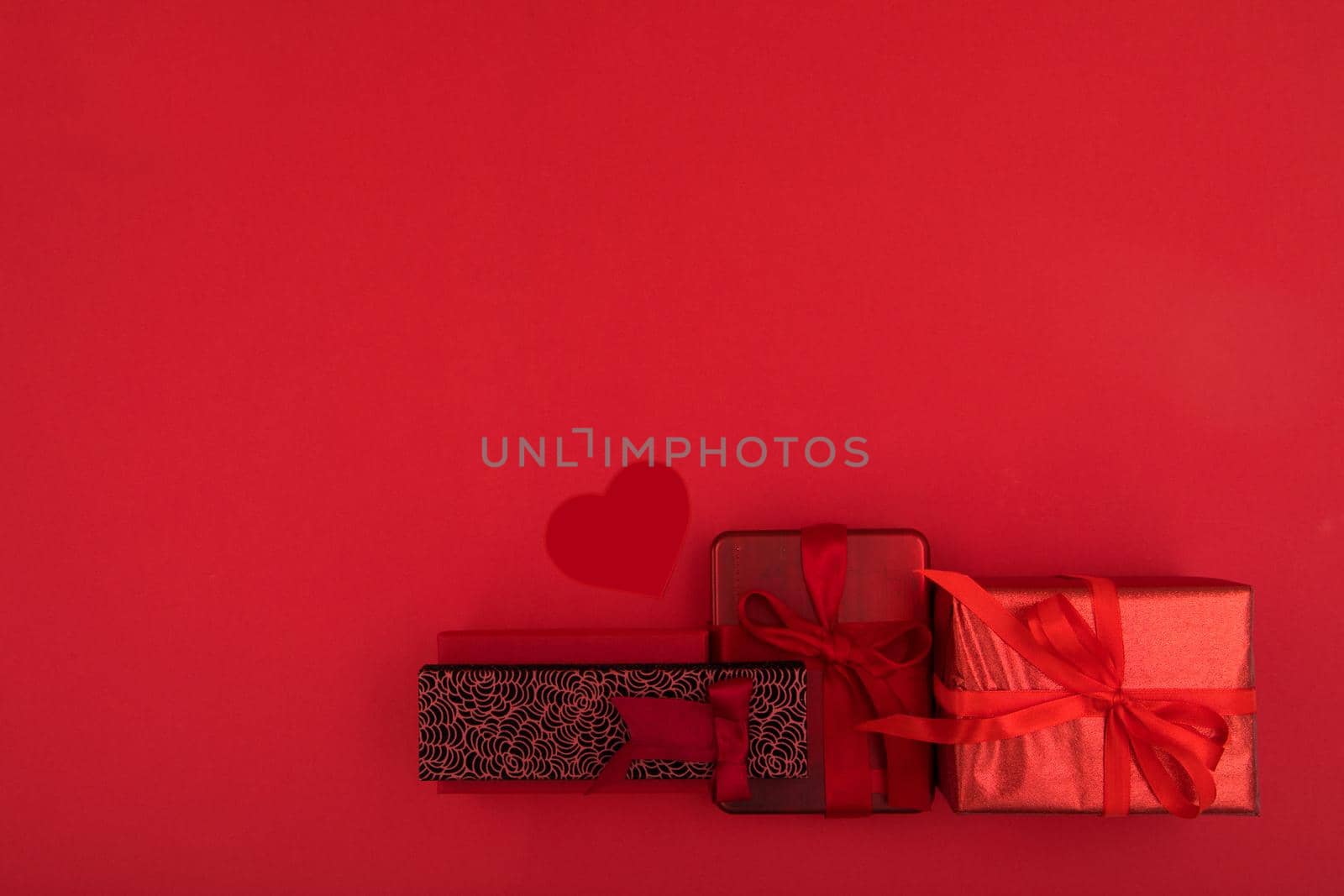 Gift boxes on red background copy space by Demkat