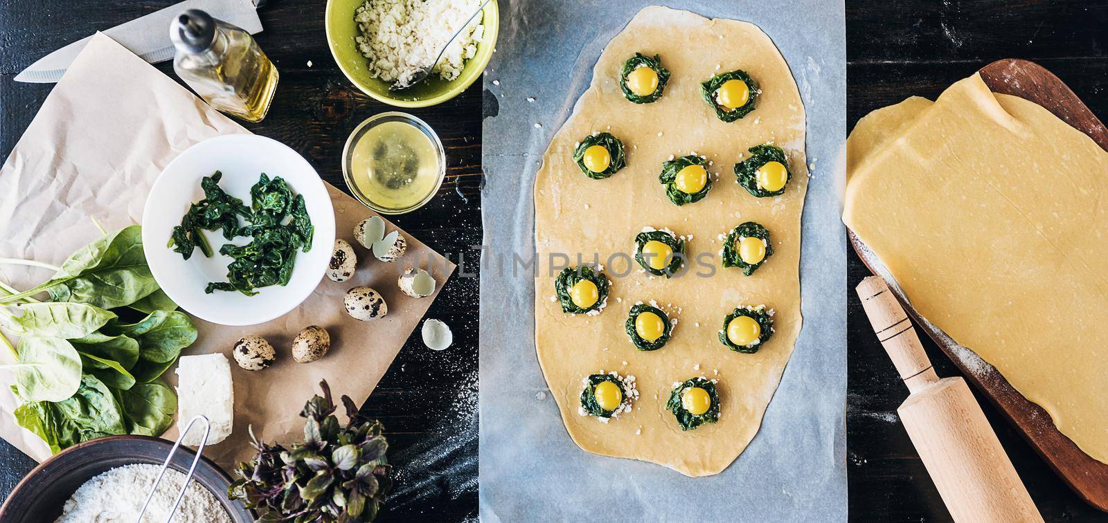 Step by step the chef prepares ravioli with ricotta cheese, yolks quail eggs and spinach with spices. The chef prepares the filling on the dough by vvmich