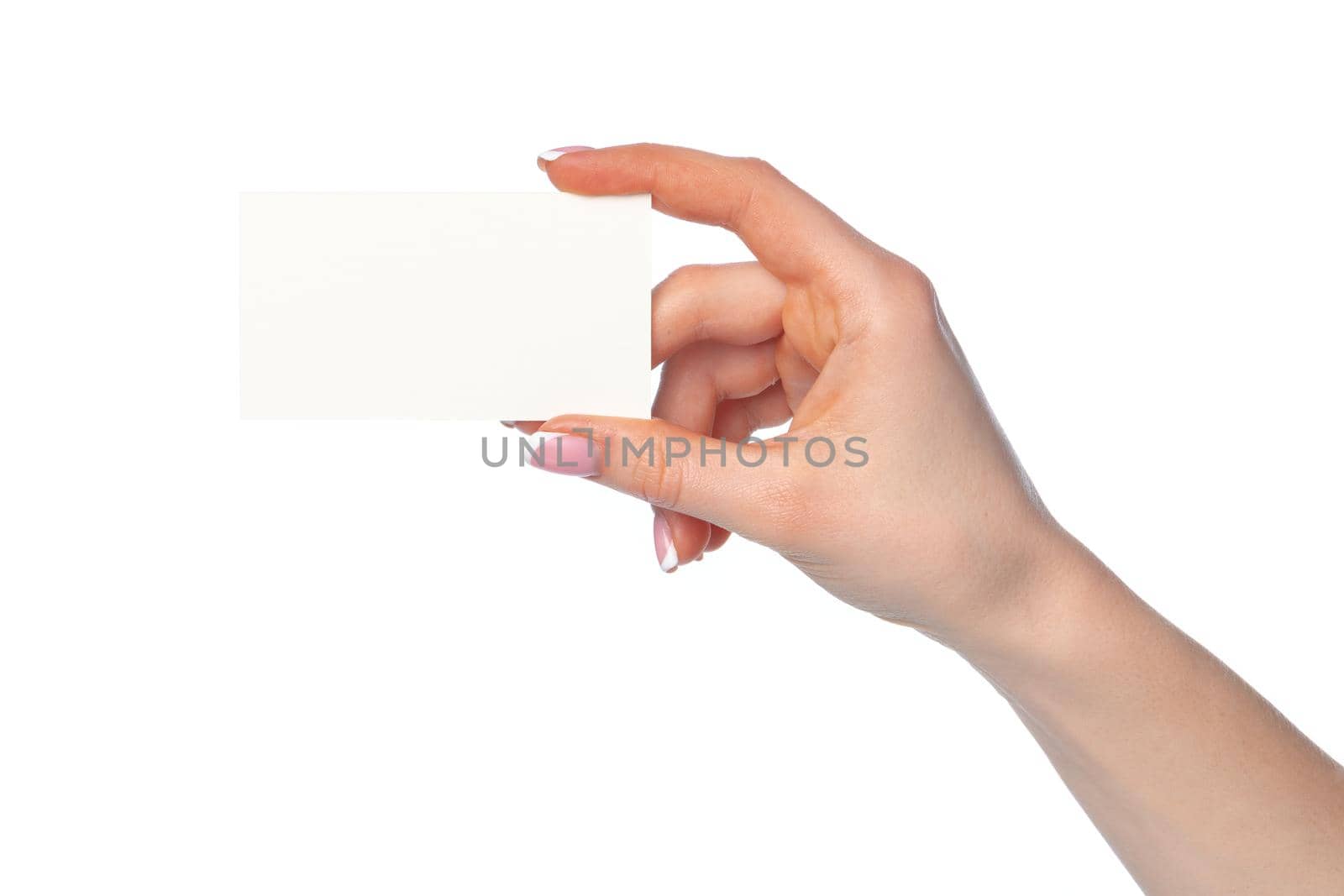 Beautiful female hand holding white business card isolated on white background