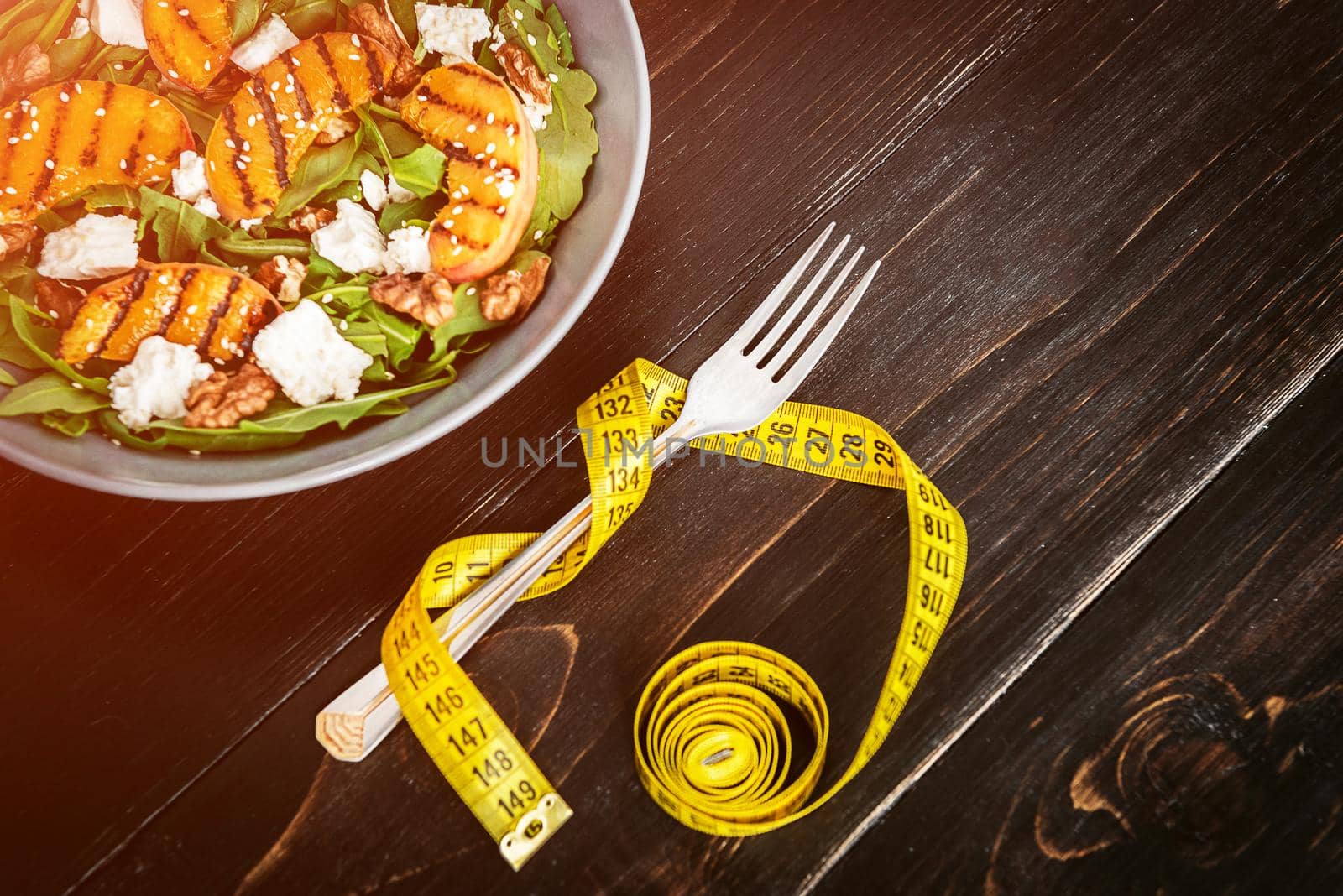 Salad of peaches grilled, ricotta and arugula. Healthy food by vvmich