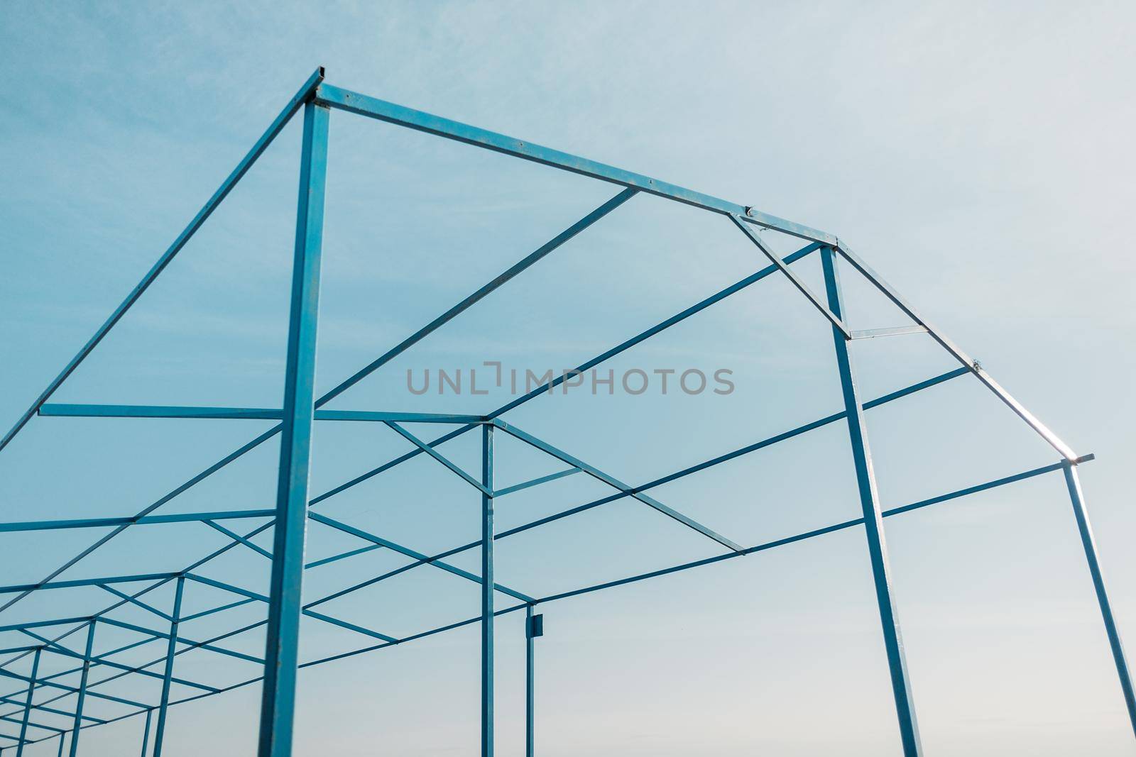 Minimalistic geometric metal construction on the sky background.