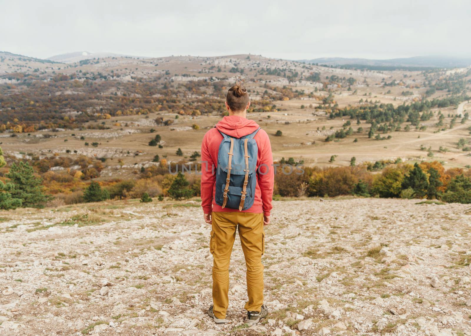 Traveler young man walking in autumn outdoor.