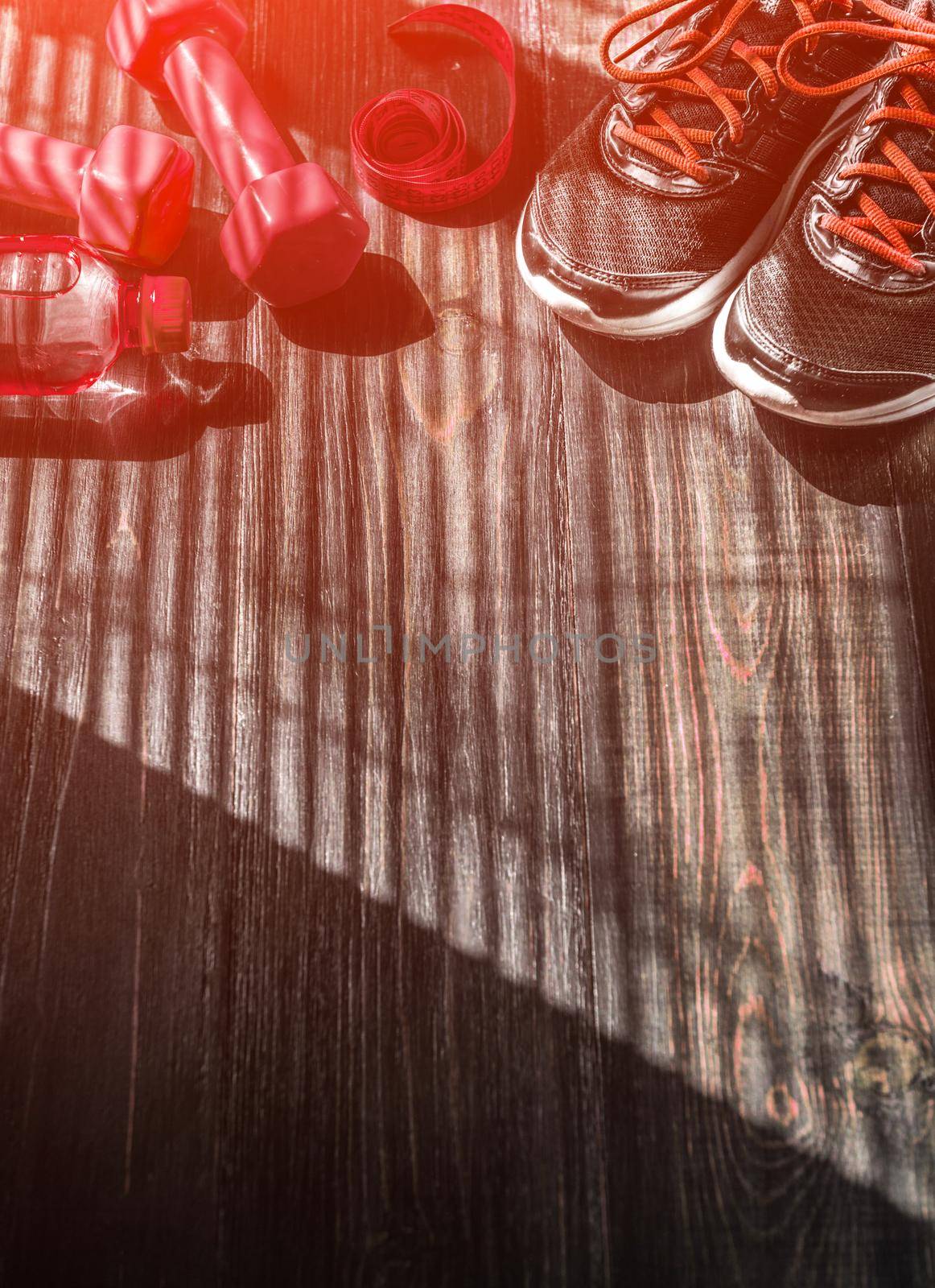 Sneakers dumbbells and a bottle of water. Flat view. All in one color. by vvmich