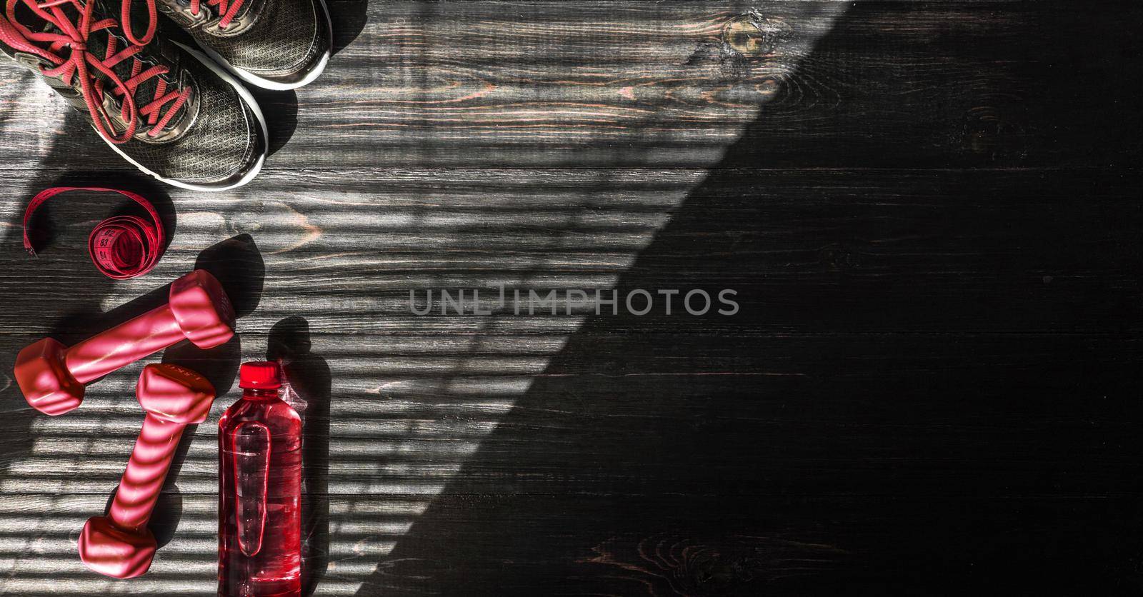 Sneakers dumbbells and a bottle of water. Flat view. All in one color. by vvmich