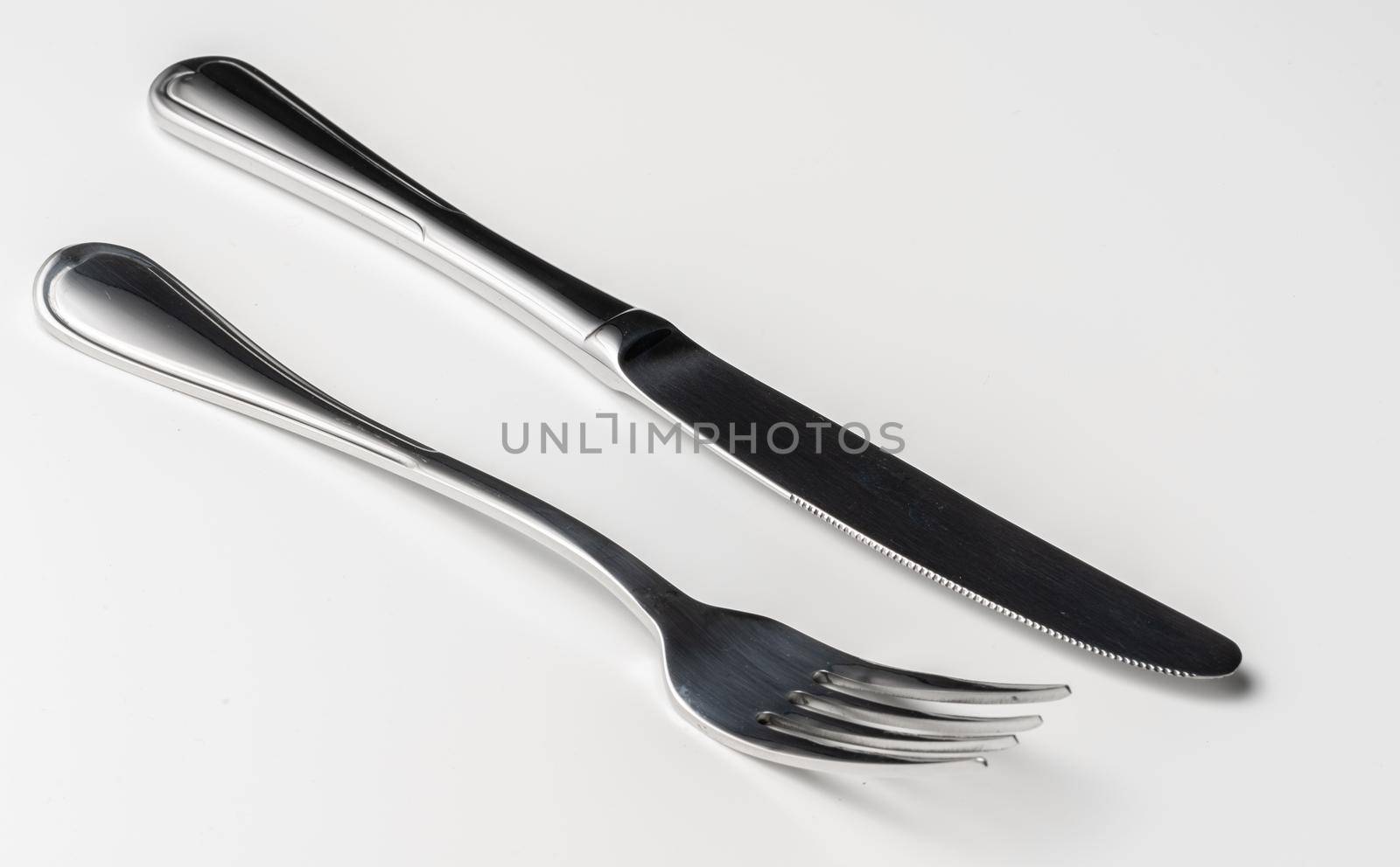 Fork and knife isolated on white background. Close up.