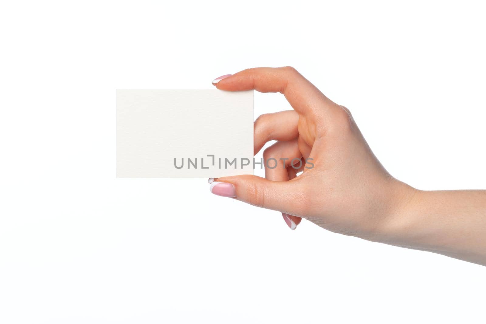 Female hand with blank white business card isolated on white background