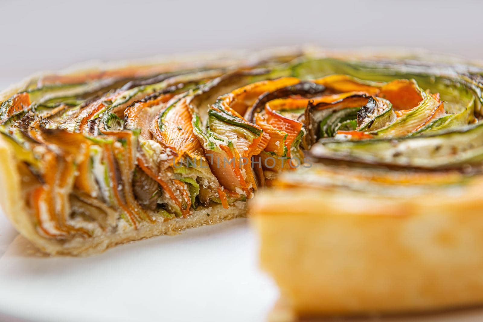 classic ratatouille pie on a light gray table.