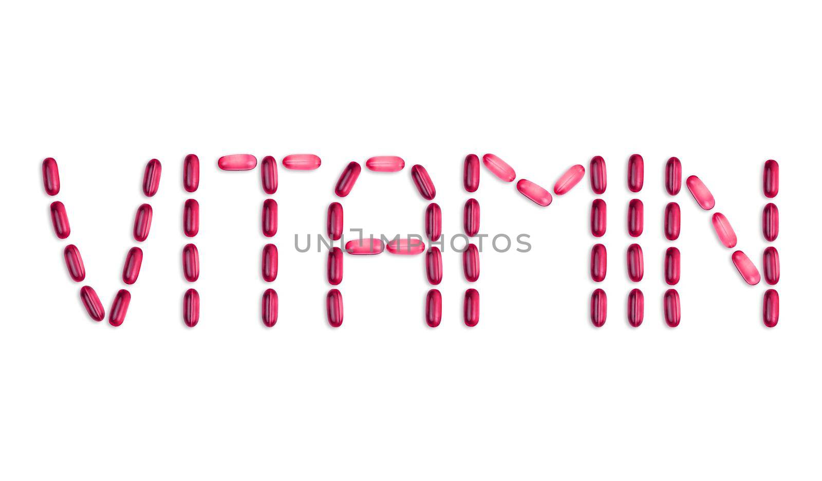 The word Vitamin is laid out with pills. The word Vitamin is laid out with gel pills on a white background with copy space for text by lunarts