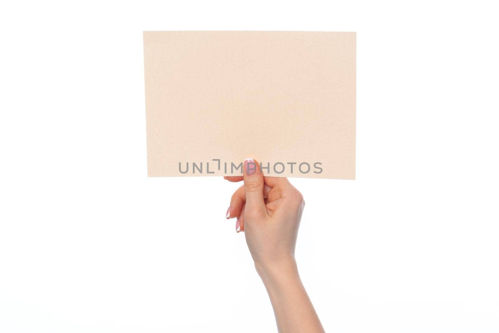 Craft paper card in female hand isolated on white by Fabrikasimf