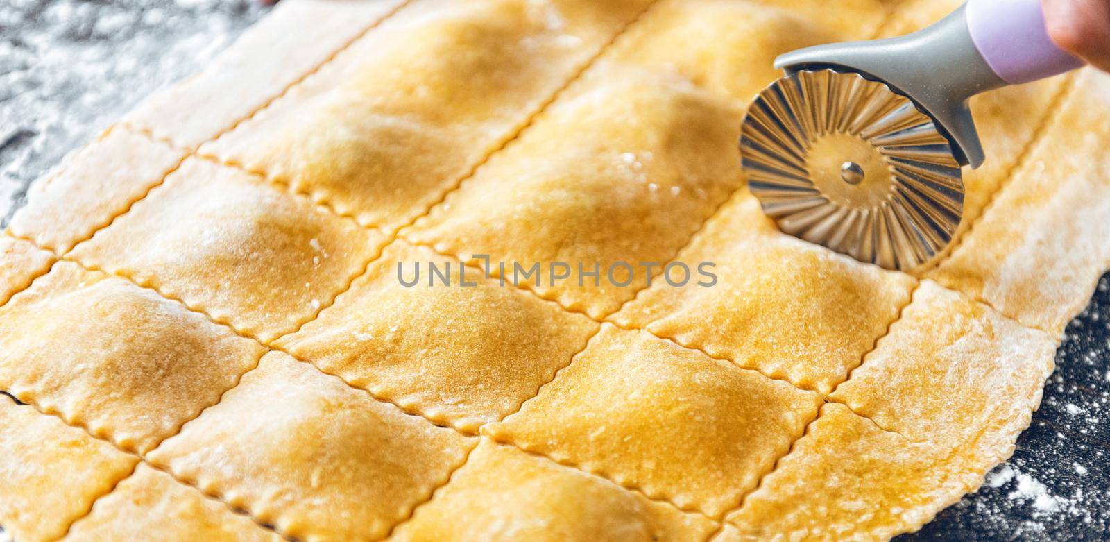 Woman chef cooks step by step the traditional ravioli