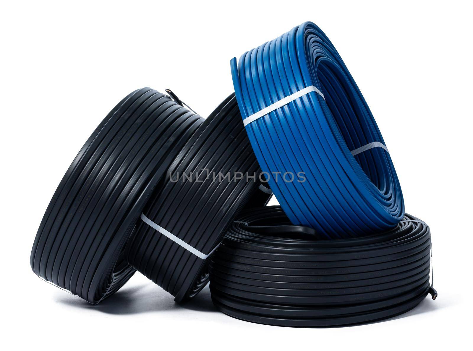 Coils of black and blue cable isolated on white background. Close up.