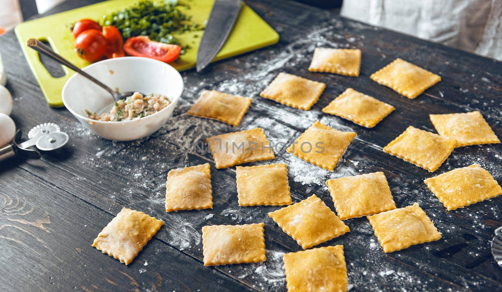 Woman chef cooks step by step the traditional ravioli