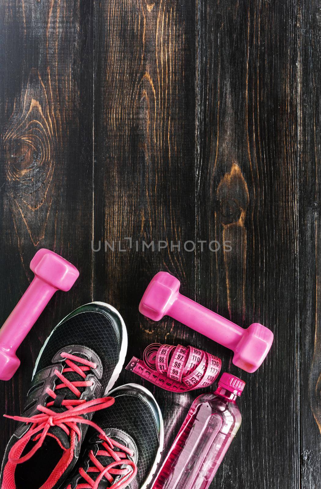 Sneakers dumbbells and a bottle of water. Flat view. All in one color.