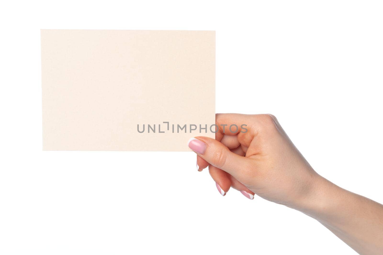 Female hand holding blank white sheet of paper isolated on white background