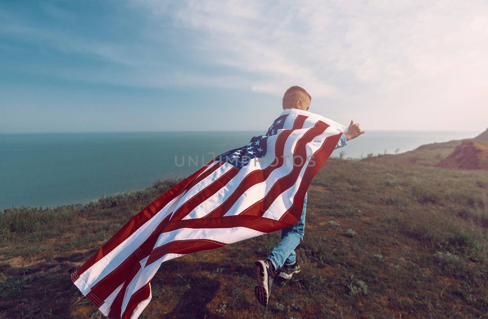 teen boy with american flag by vvmich