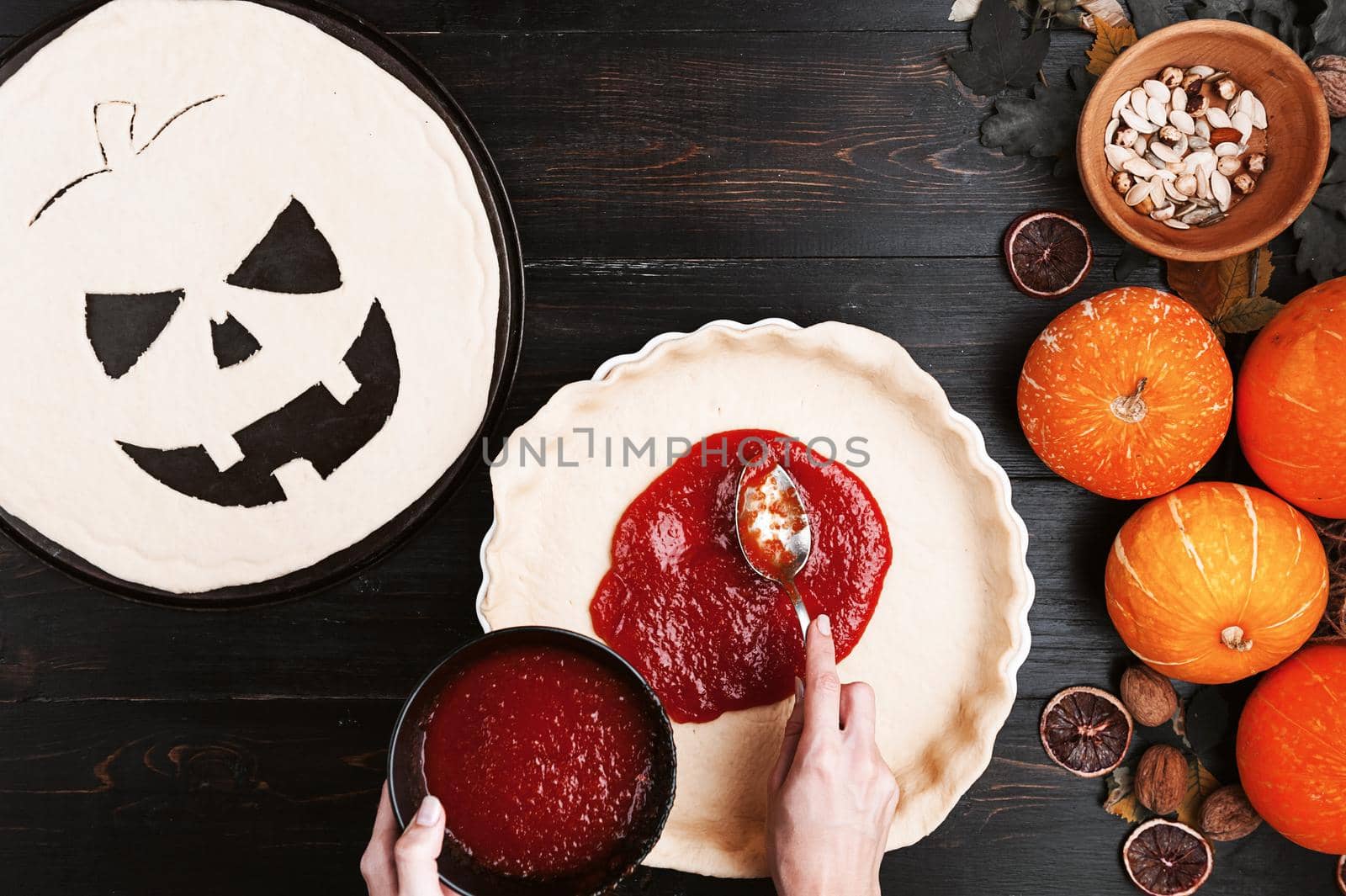 Chef cooks a pie for Halloween with a filling of pumpkin-strawberry jam and peaches