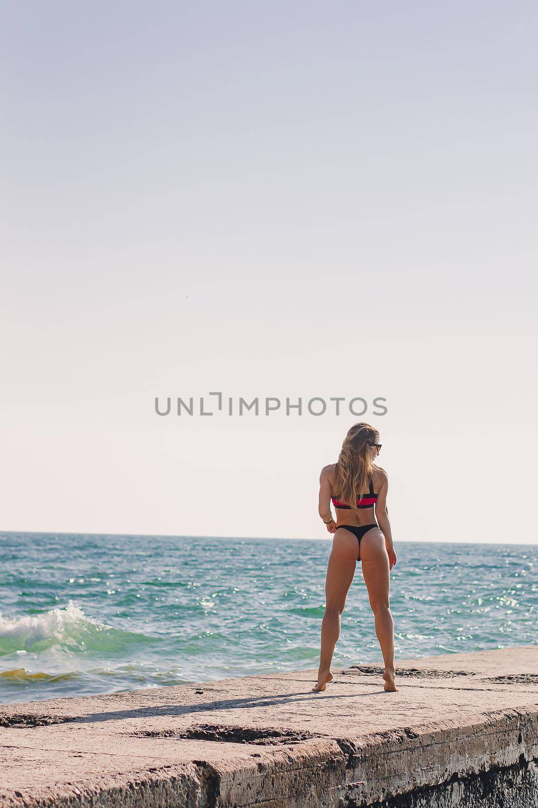 Young healthy lifestyle sport fitness instructor happy woman in bikini on beach