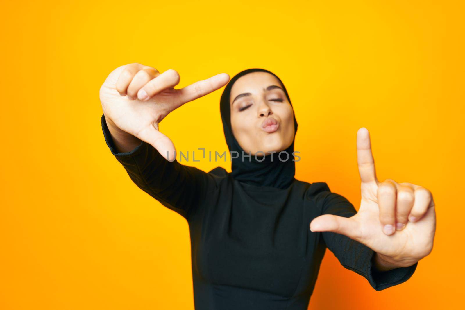 arab woman in black hijab posing fashion hand gesture studio lifestyle by Vichizh