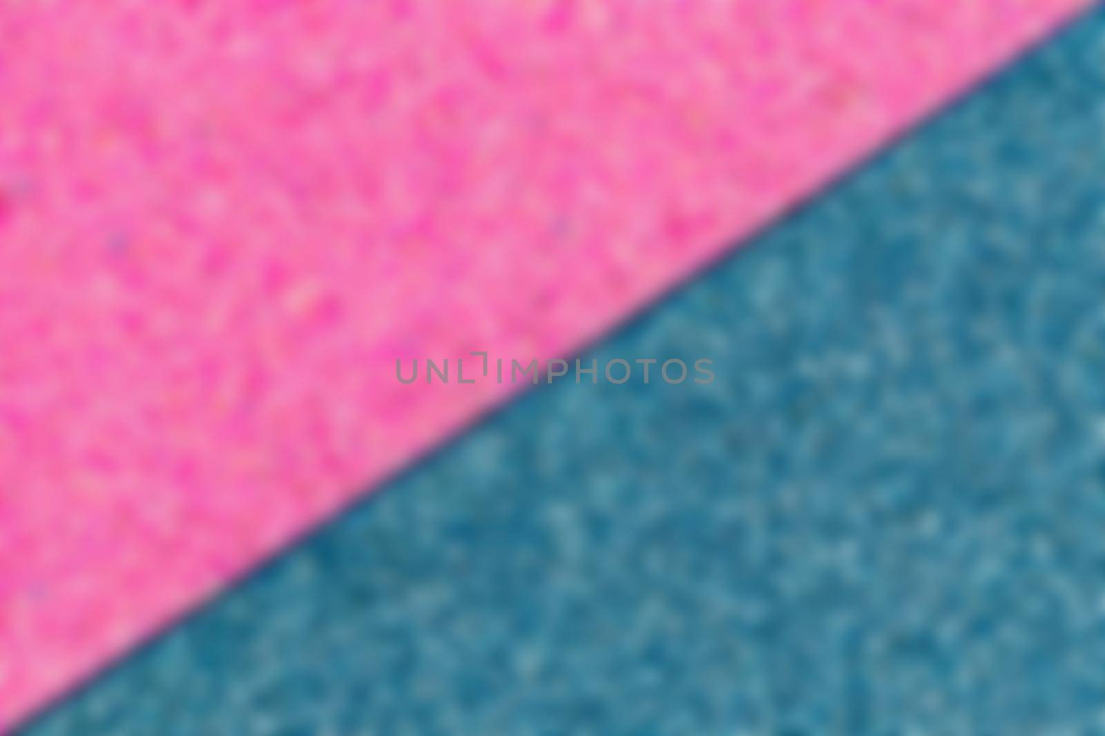 Blurred Blue and pink glitter texture abstract background. Shape of the triangle.